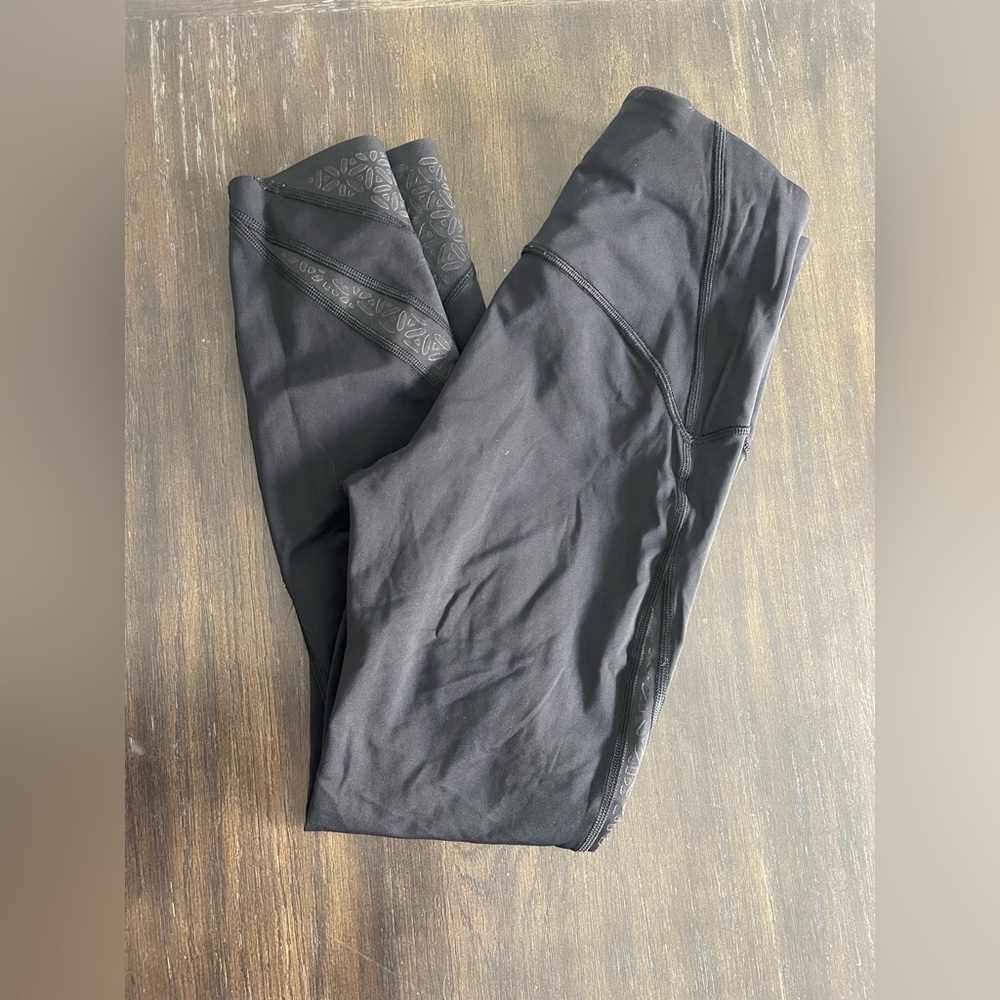 Lululemon capris with laser mesh floral detailing